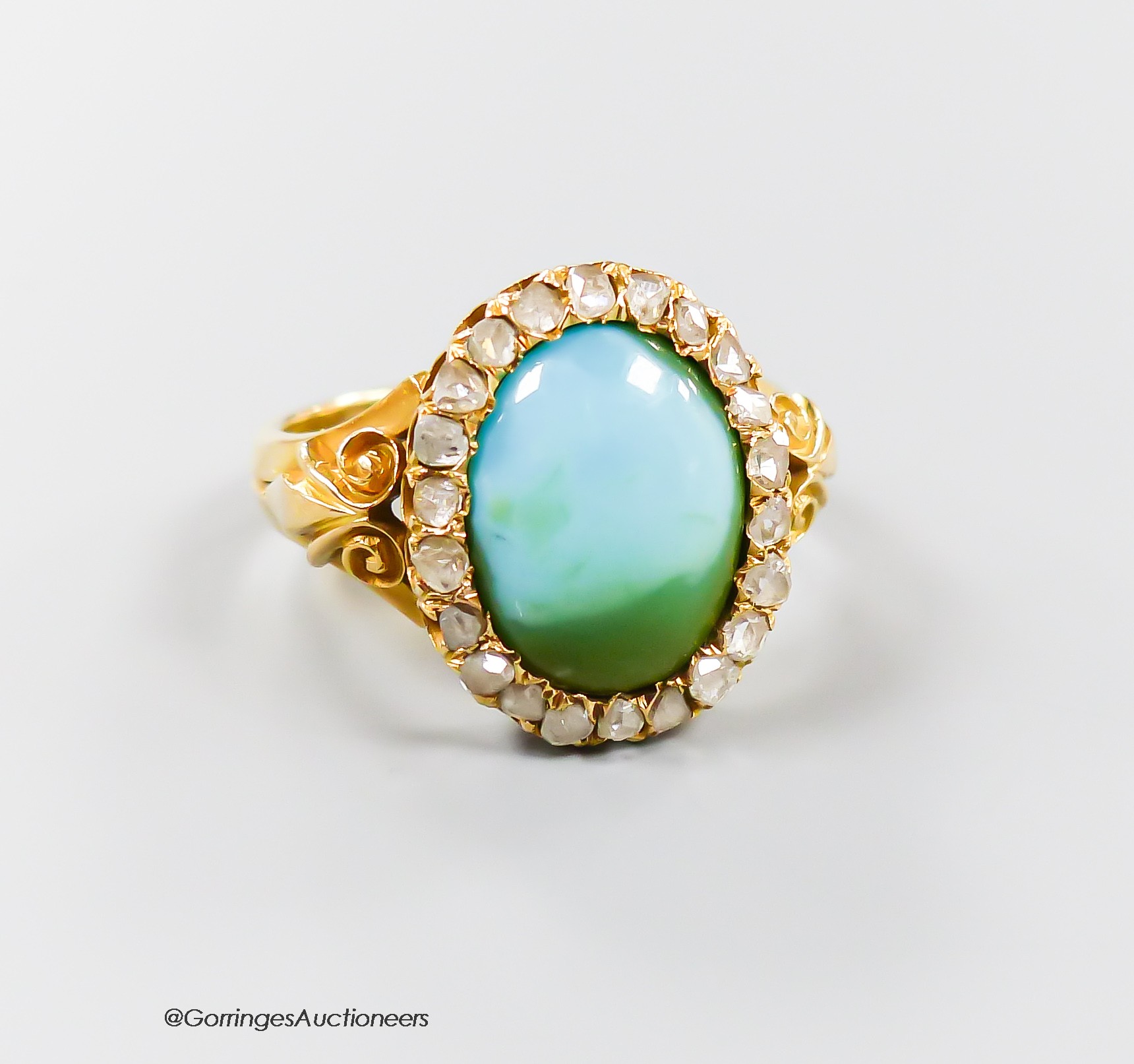 A late Victorian 18ct gold, turquoise and rose cut diamond set oval cluster ring, size L, gross 5.7 grams (shank cut).